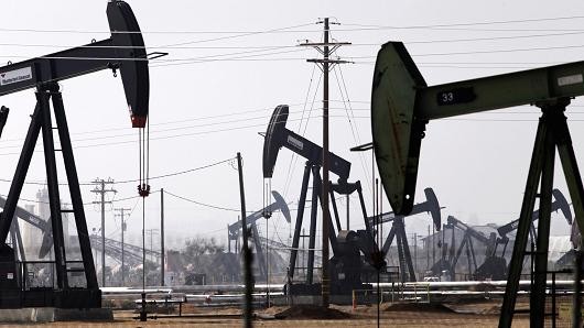 Oil hits one-month high near $55 on tighter supplies